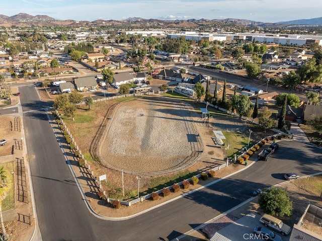 birds eye view of property with a mountain view