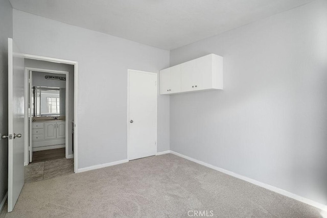 unfurnished bedroom with light carpet