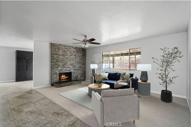 living room with a fireplace and ceiling fan