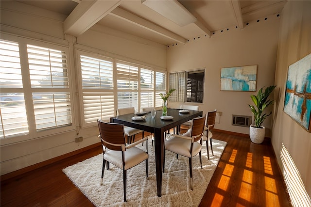 dining space featuring beam ceiling, baseboard heating, and dark hardwood / wood-style floors