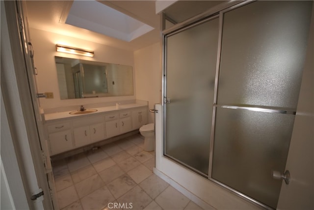 bathroom with vanity, toilet, and tile patterned floors