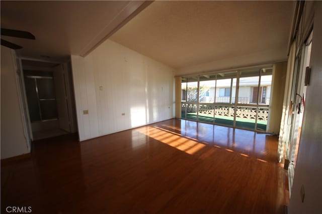 unfurnished room featuring dark hardwood / wood-style floors and ceiling fan