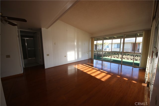 unfurnished room featuring ceiling fan and dark hardwood / wood-style flooring