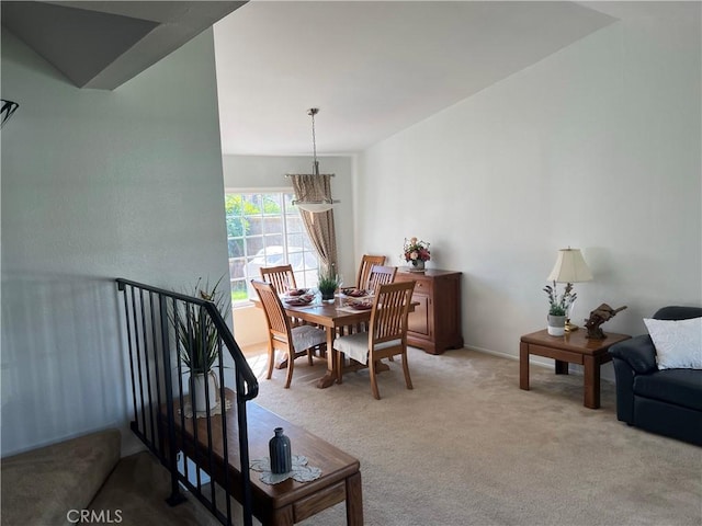 dining space with light colored carpet