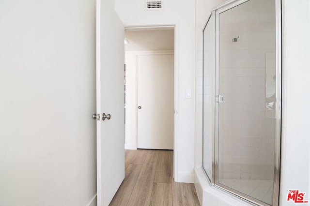 corridor with light hardwood / wood-style flooring