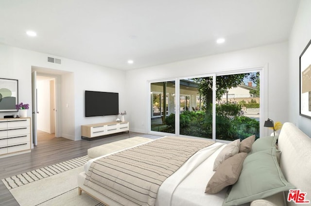 bedroom with dark hardwood / wood-style flooring