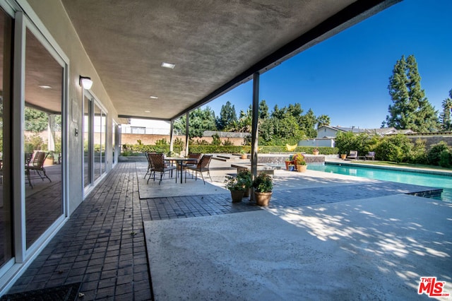 view of patio / terrace featuring a fenced in pool