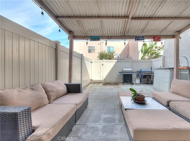 view of patio featuring outdoor lounge area and a grill