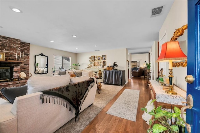 interior space with a fireplace and light hardwood / wood-style flooring