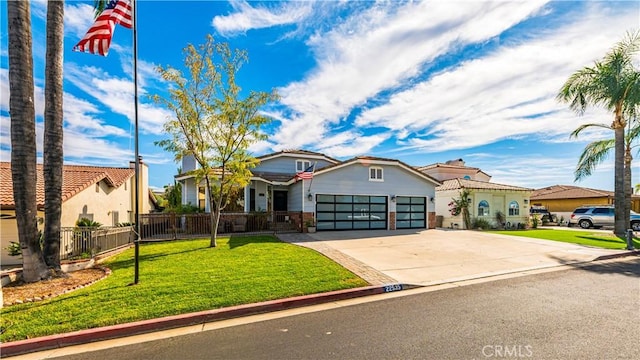 view of front of home with a front yard and a garage