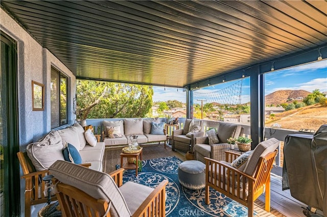 sunroom featuring a mountain view