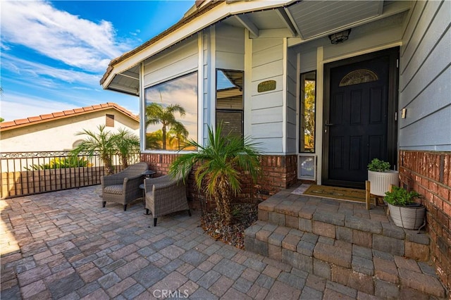 doorway to property featuring a patio area