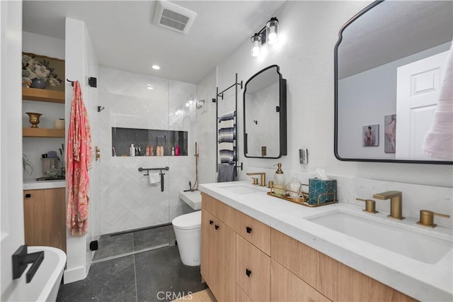 bathroom with tile patterned floors, a shower with door, vanity, and toilet