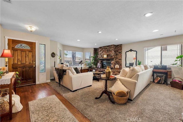 living room featuring a fireplace and dark hardwood / wood-style floors