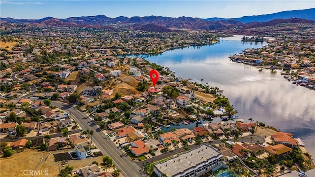 birds eye view of property featuring a water and mountain view