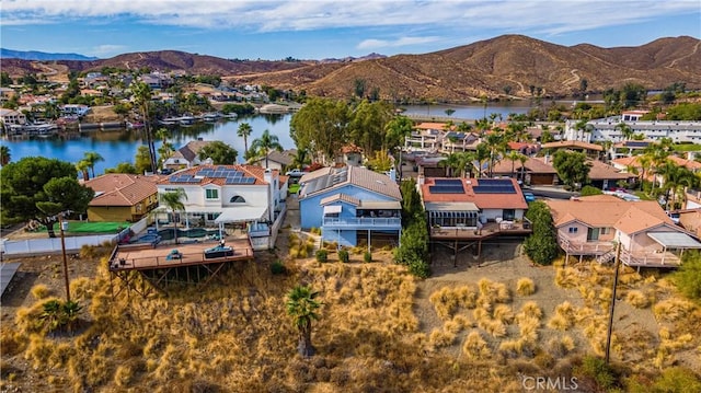 bird's eye view with a water and mountain view