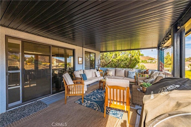 deck featuring outdoor lounge area