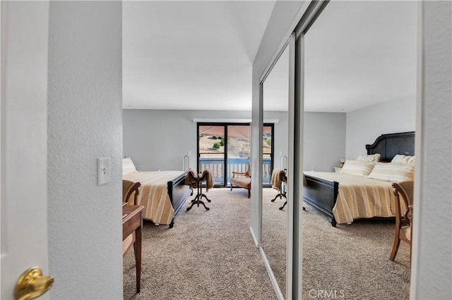 bedroom featuring carpet, french doors, and access to exterior