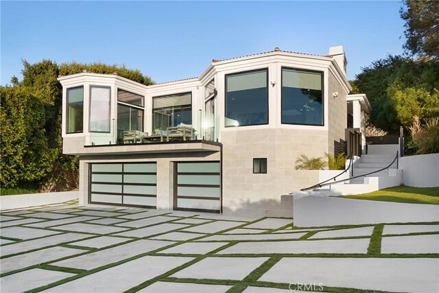 view of front of property with a garage