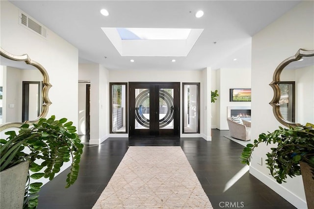 entryway with baseboards, visible vents, and recessed lighting