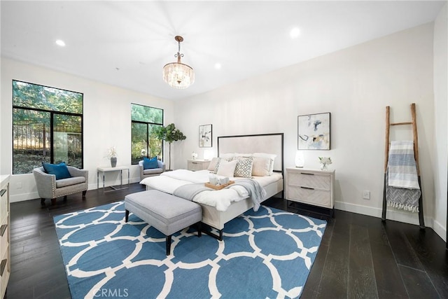 bedroom with a notable chandelier, baseboards, hardwood / wood-style floors, and recessed lighting