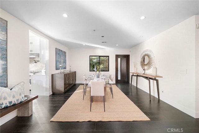 dining area with dark wood-style floors, recessed lighting, visible vents, and baseboards