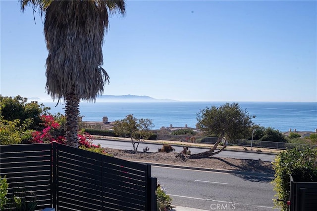 property view of water featuring fence