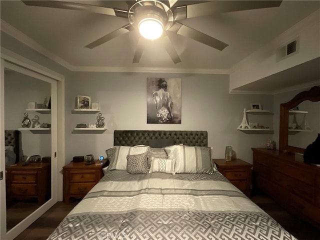 bedroom featuring ceiling fan, crown molding, and dark wood-type flooring