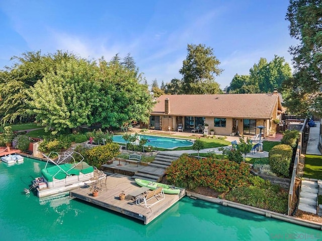 view of swimming pool with a patio