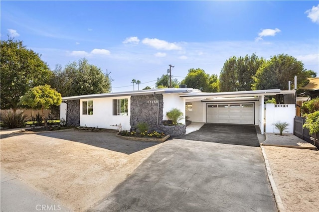 single story home featuring a garage