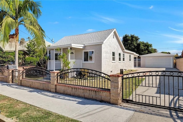 view of front of property featuring a garage and an outdoor structure