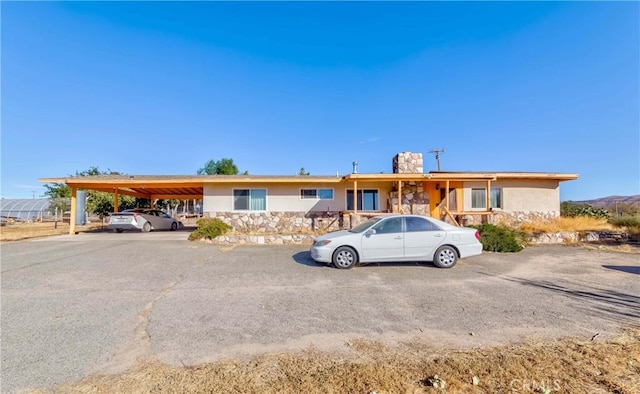 ranch-style home with a carport