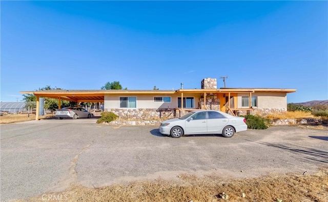 11507 Savage Ln, Apple Valley, CA 92308 - single story home with uncovered parking, a chimney, and stucco siding
