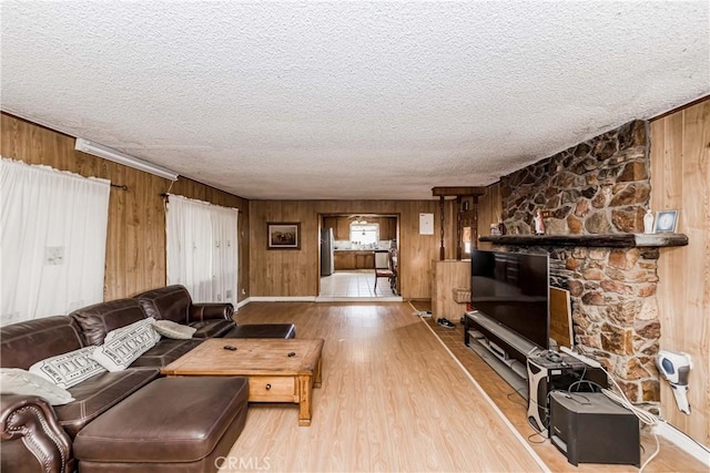 11507 Savage Ln, Apple Valley, CA 92308 - living room with a textured ceiling, wood finished floors, and wooden walls