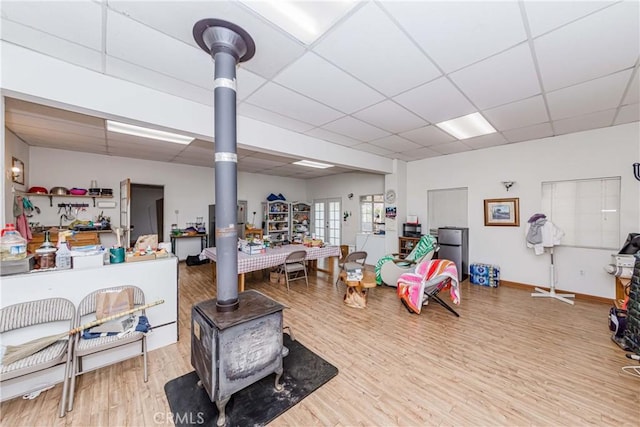 interior space with light hardwood / wood-style flooring and a drop ceiling