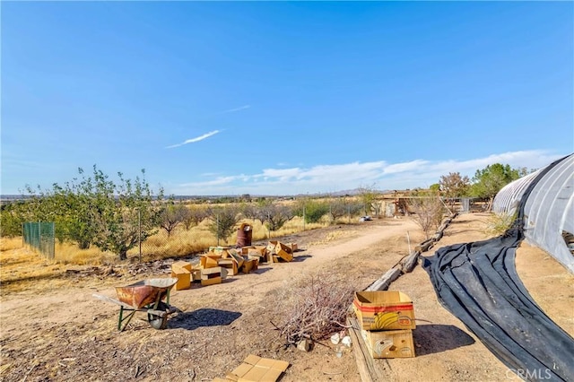 view of yard with a rural view