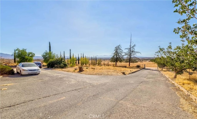 11507 Savage Ln, Apple Valley, CA 92308 - view of asphalt road featuring a view of rural / pastoral area and a mountain view