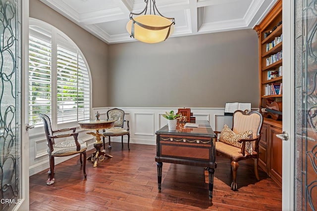 living area with beam ceiling, ornamental molding, dark wood-type flooring, and coffered ceiling