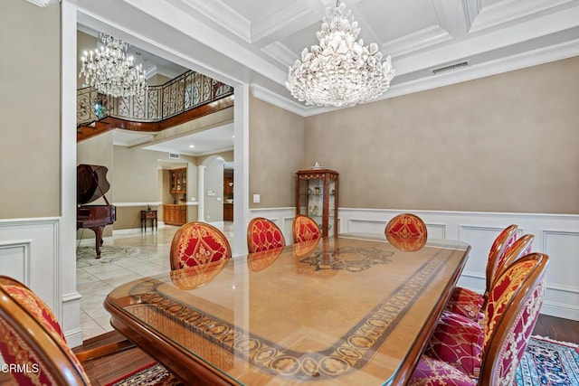 tiled dining room featuring beam ceiling, crown molding, and coffered ceiling