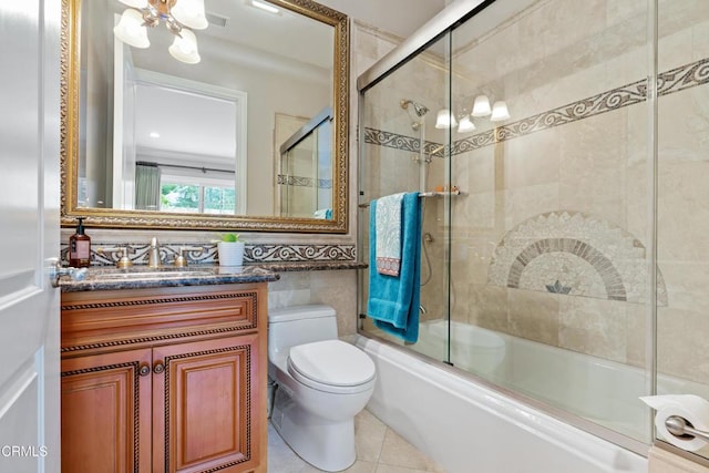 full bathroom with vanity, tile patterned flooring, toilet, enclosed tub / shower combo, and tile walls