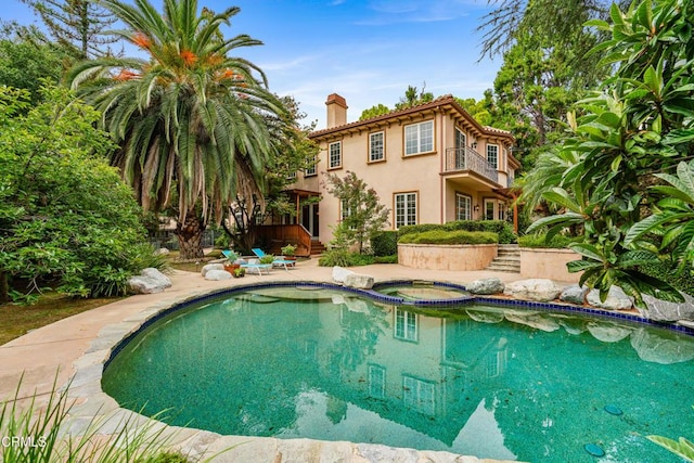 view of swimming pool with an in ground hot tub and a patio