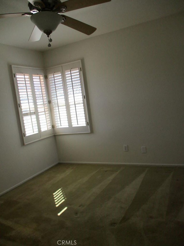 carpeted empty room with ceiling fan