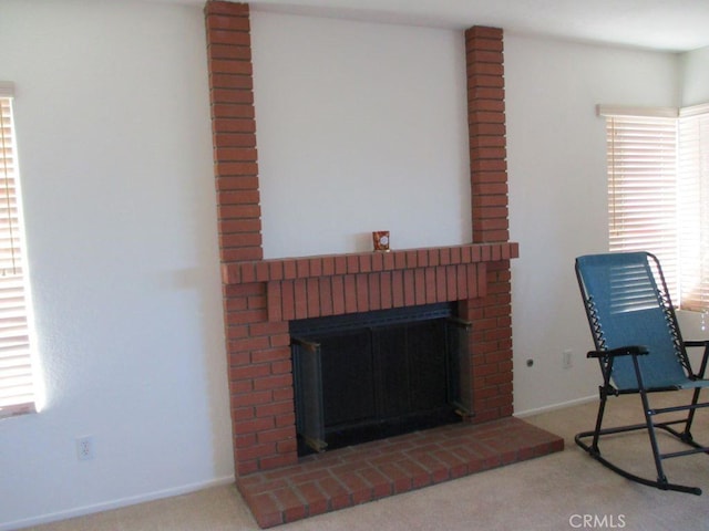 living room with carpet flooring and a fireplace