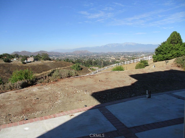 view of yard with a mountain view and a patio area