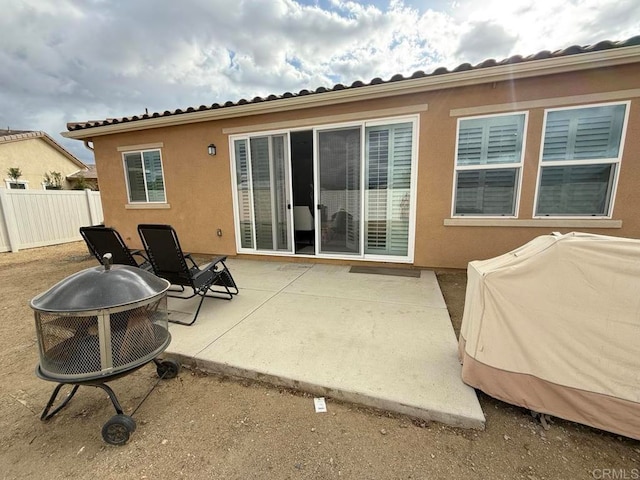 back of property with a patio