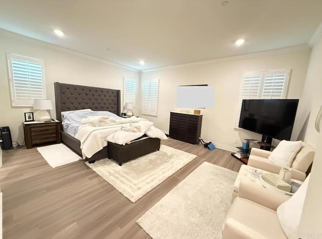 bedroom featuring crown molding and light hardwood / wood-style flooring