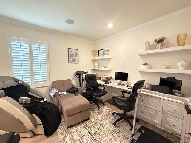 office space with crown molding and light wood-type flooring