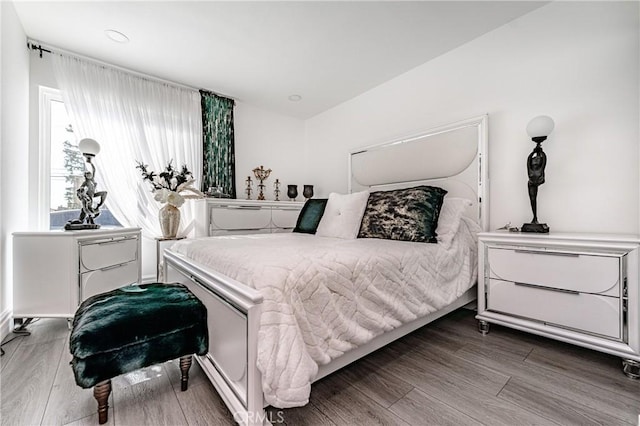 bedroom featuring dark hardwood / wood-style flooring