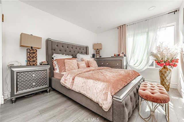 bedroom with light wood-type flooring