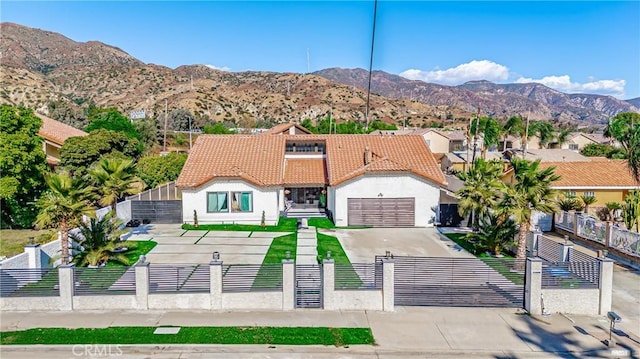 birds eye view of property with a mountain view